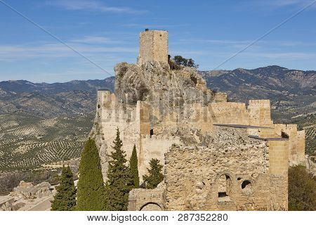 Ancient Castle Tower And Olive Fields In Jaen. Spain