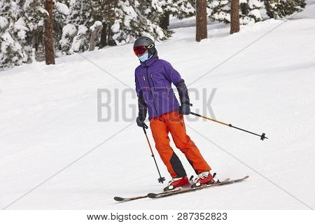Skiing On A Forest Slope. White Mountain Landscape. Winter Sport