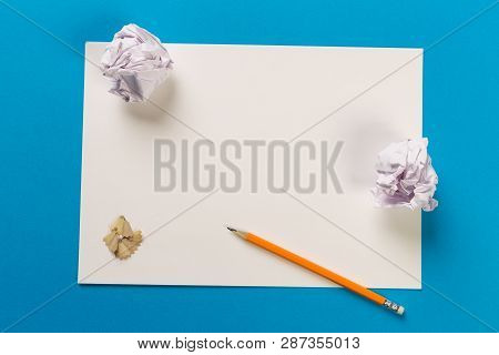 Pencils With Sharpening Shavings With White Paper Sheets On Coloured Backgroung, Office Tool, Rolled