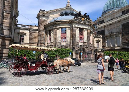 Dresden, Germany - May 10, 2018: People Ride A Horse Carriage Tour In Altstadt (old Town) District O