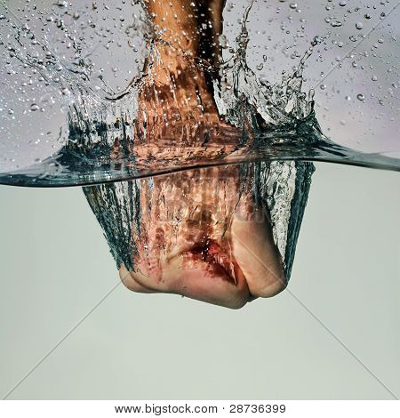 Fist Punching Water in Anger