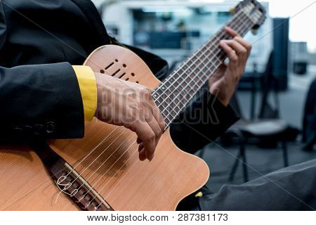 Details Of Hands Of A Musician Playing Acustic Guitar, Guitarist Without Plectrum, Fingers With Long