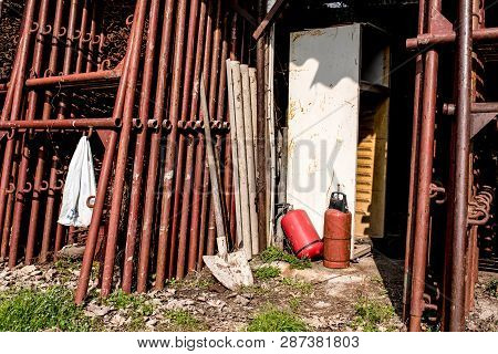 Scaffolding Storage Area In Outdoor, Detail Of Stacks Of Pipes, Poles, Used And Rusty Staffolding