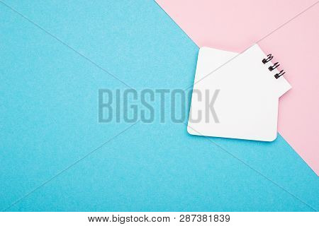 Empty Notebook Or Notepad On Pink And Blue Background With A Double Color Stationery. Creative Minim
