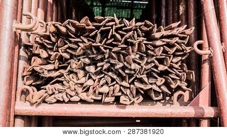 Scaffolding Storage Area In Outdoor, Detail Of Stacks Of Pipes, Poles, Used And Rusty Staffolding