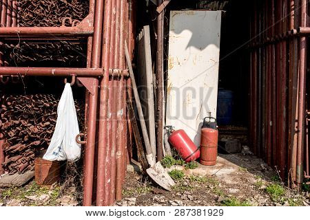 Scaffolding Storage Area In Outdoor, Detail Of Stacks Of Pipes, Poles, Used And Rusty Staffolding