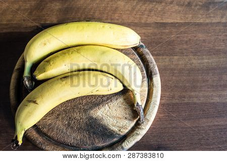 Three Bananas On A Chopping Board, Heakthy Ffood, Tropical Fruits