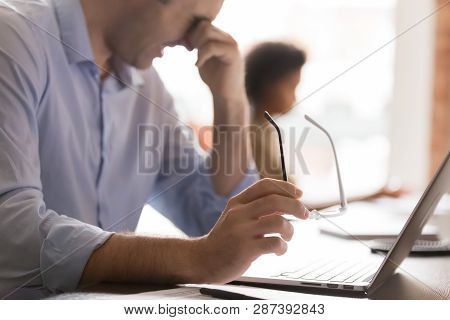 Eyestrain Concept, Tired Businessman Holding Glasses Rubbing Dry Irritable Eyes