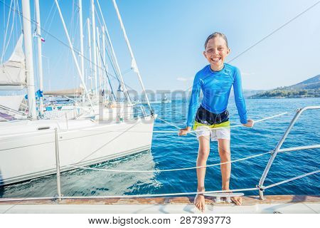 Little Boy Having Fun On Board Of Yacht On Summer Cruise. Travel Adventure, Yachting With Child On F