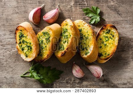 Homemade Garlic Bread On Wooden Table. Top View