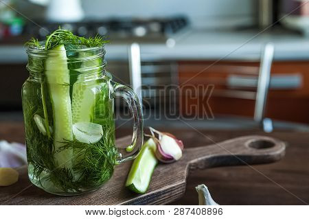 Marinated Cucumbers Gherkins. Pickles With Mustard And Garlic. Glass Jar With Fermented Cucumbers On