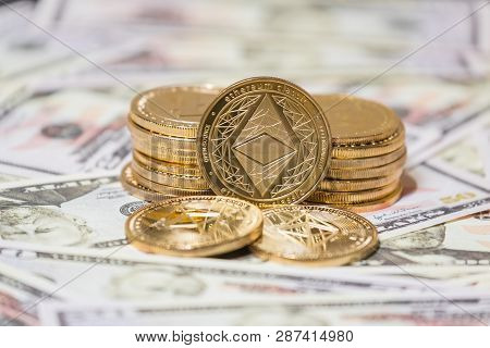 Golden Etherium Coin On Us Dollars Close Up. Business Concept Of Crypto Currency.