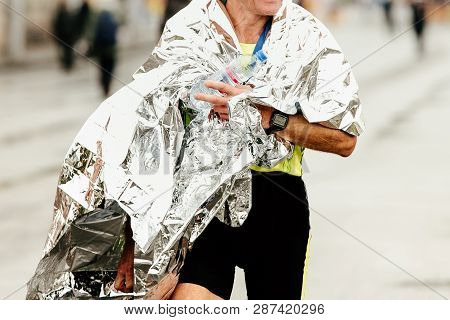 Man Athlete Runner After Finish Marathon Covered Foil Wrap