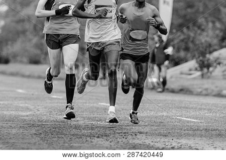 Leading Group Of Athletes Runners Running Marathon Black-and-white Image