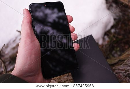Modern mobile phone with large screen, close-up and assembly details