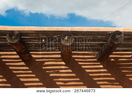 Creative Cast Shadows From Vigas And Latillas On Exterior Adobe Wall, Horizontal Aspect