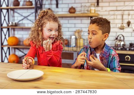 Amazing Curly-haired Kid Talking To Her Cousin