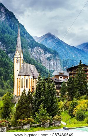 Gothic church of St. Vincenzo. The beginning of the road Grossglocknerstrasse. The village in the Austrian Alps is Heiligenblut. The concept of ecological, historical and phototourism