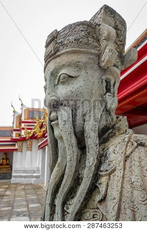 Chinese Guard Statue In Wat Pho Buddhist Temple, Bangkok, Thailand