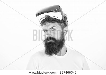 Happy Bearded Man Wearing Virtual Reality Goggles Watching Movies Or Playing Video Games. The Man Wi