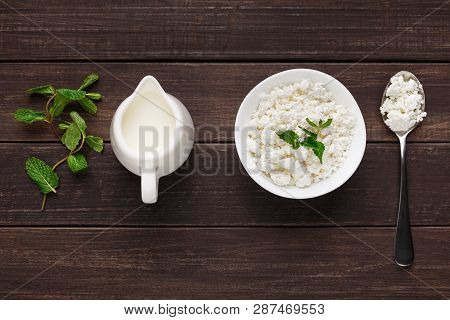 Bowl Of Cottage Cheese And Jar Of Milk On Wooden Background. Lacto Vegetarian Eating Concept