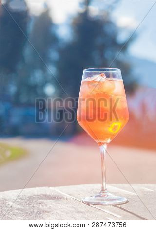 Glass Of Delicious Aperol Spritz Cocktail On Blurred Background