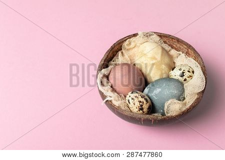Selective Focus Of Coloured Decorated Easter Eggs In Coconut Shell
