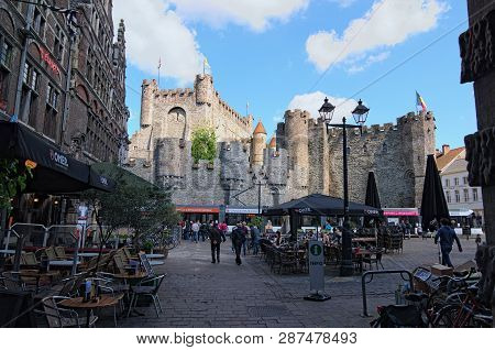Ghent, Belgium- May 03, 2018: Square With Open Air Cafes. Ancient Castle Of The Counts (dutch: Grave