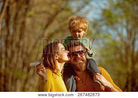Family Trust Concept. Parents And Baby Son Enjoy Sunny Day In Park, Family Trust. Blood Is Thicker T