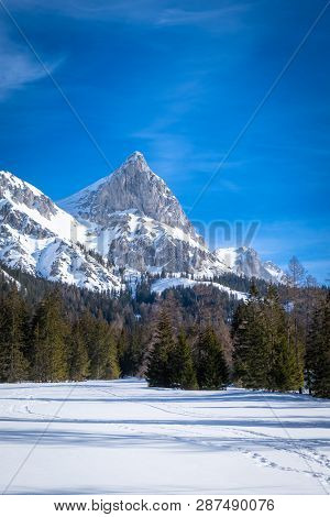 Portrait View Over Snowy Plateau Kaiserau With Mountain Admonter Kalbling On A Sunny Winterday In St