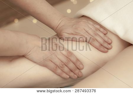 Hands Masseur Doing Anti-cellulite Massage On The Legs Of A Young Girl