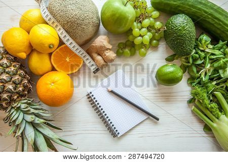Flat Lay Composition With Measuring Tape, Healthy Vegetables And Fruit On Wooden Background. Weight 
