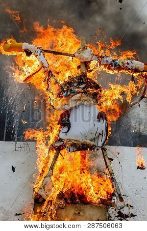 Spring Meeting. Close-up Faceless Straw Effigy Of Dummy Of Maslenitsa, Symbol Of Winter And Death In