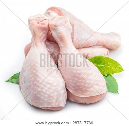Raw chicken legs isolated on white background.