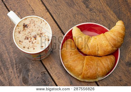 Bright Morning Meal - Croissants And Latte Coffee In Mug On A Timber Table.