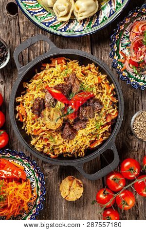 Traditional Uzbek Oriental Cuisine. Uzbek Family Table From Different Dishes In National Dishes For