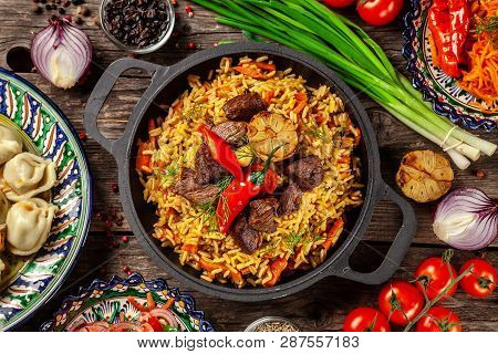 Traditional Uzbek Oriental Cuisine. Uzbek Family Table From Different Dishes In National Dishes For