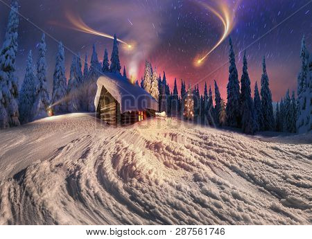 Climbing To Tourist Wild Alpine Mountain To An Abandoned Cabin-in Order To Illuminate The Snow-cover