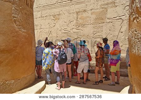 Karnak, Egypt - 17th May, 2018: A Group Of Adult Caucasian Tourists Visiting The Interior Of The Tem