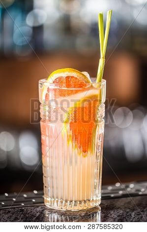Paloma Cocktail Tequila Drink With Grapefruit At Barcounter In Night Club Or Restaurant.