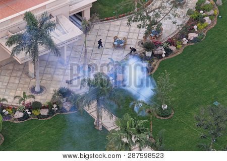 Cairo, Egypt - February 25, 2010: Spraying Mosquitoes With Insecticide At Garden In Cairo, Egypt.