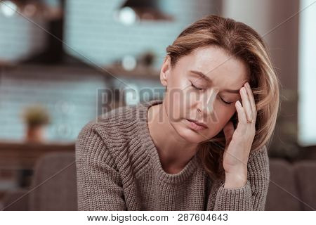 Mature Woman Feeling Sick And Lonely Staying Home Alone