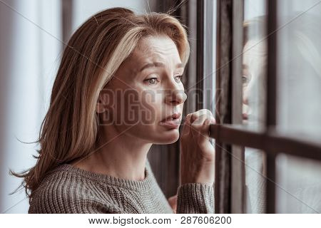 Woman Feeling Emotional Seeing Car Accident From The Window