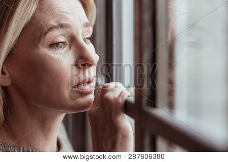 Mature Woman With Facial Wrinkles Feeling Stressed And Sad