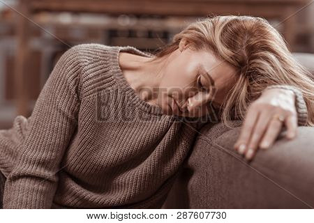 Close Up Of Woman Feeling Awful After Divorce With Husband