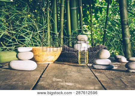 Spa Background With Woman's Hands And Clear Water On An Old Wooden Table. Japanese Style. Simplicity