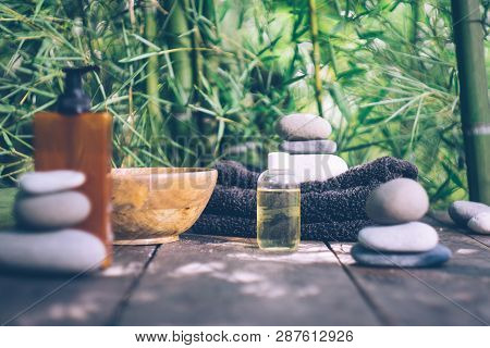 Spa Background With Woman's Hands And Clear Water On An Old Wooden Table. Japanese Style. Simplicity