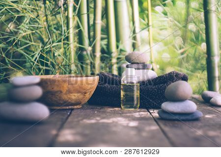 Spa Background With Woman's Hands And Clear Water On An Old Wooden Table. Japanese Style. Simplicity