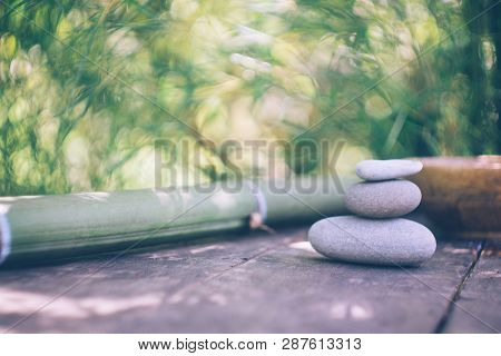Spa Background With Woman's Hands And Clear Water On An Old Wooden Table. Japanese Style. Simplicity