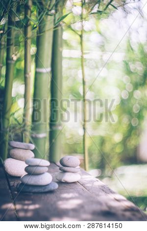 Spa Background With Woman's Hands And Clear Water On An Old Wooden Table. Japanese Style. Simplicity